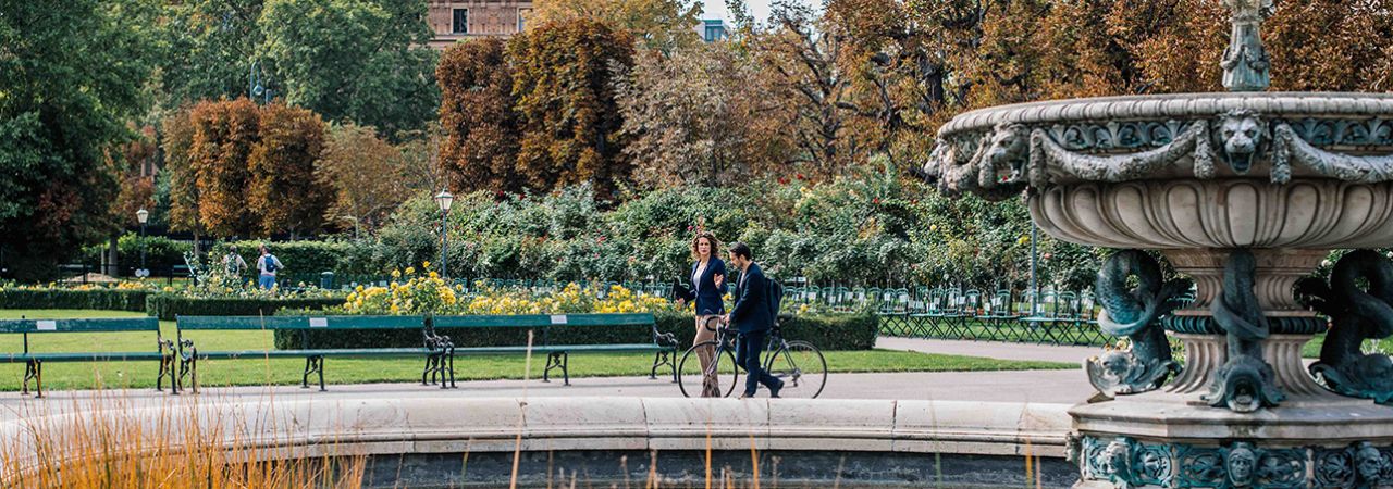 Walkers stroll past the fountains